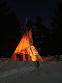 Tipi glowing at night